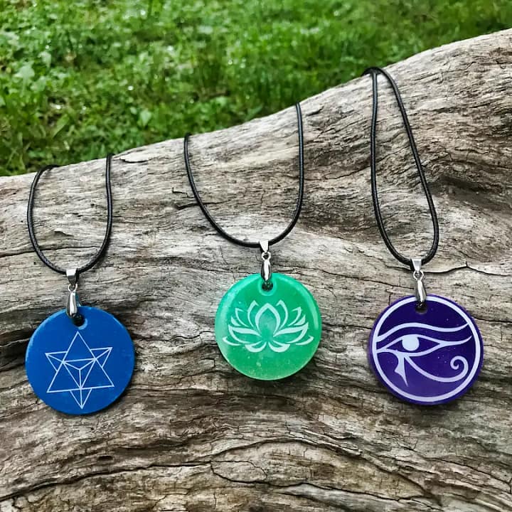 Resin pendants with symbol Symbolily